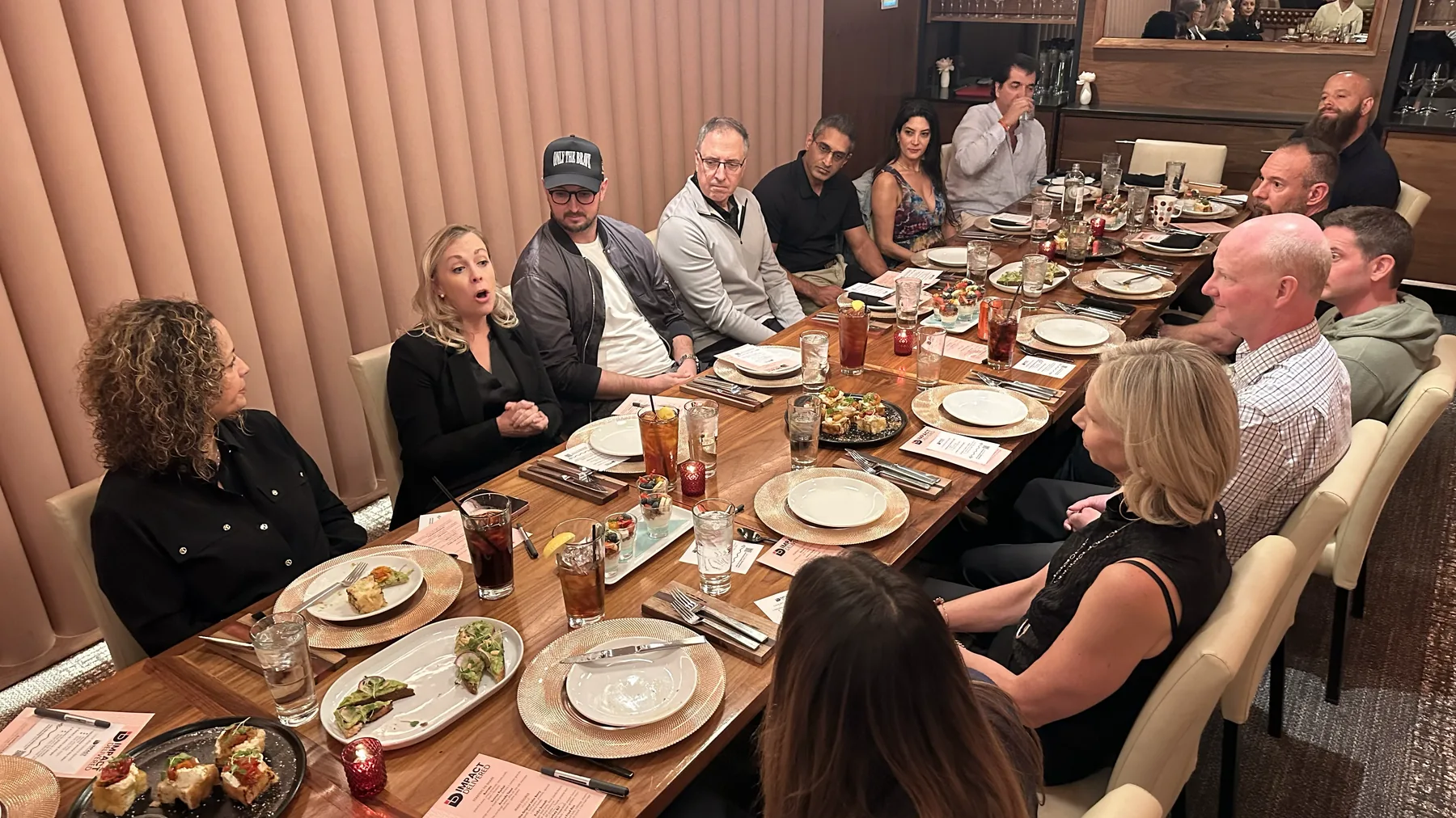 Impact Delivered members in conversation